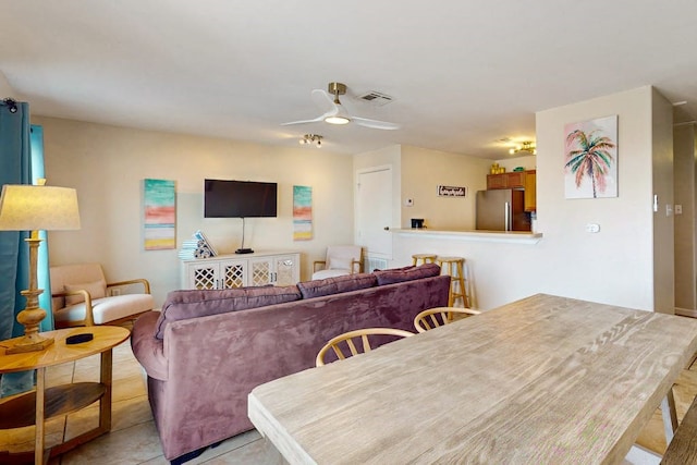 dining room featuring ceiling fan and light tile patterned floors