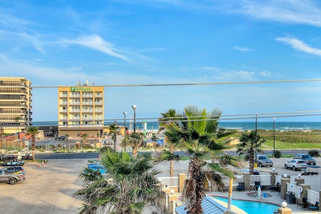 view of pool with a water view