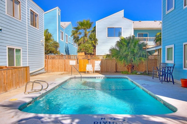 view of swimming pool with a patio area