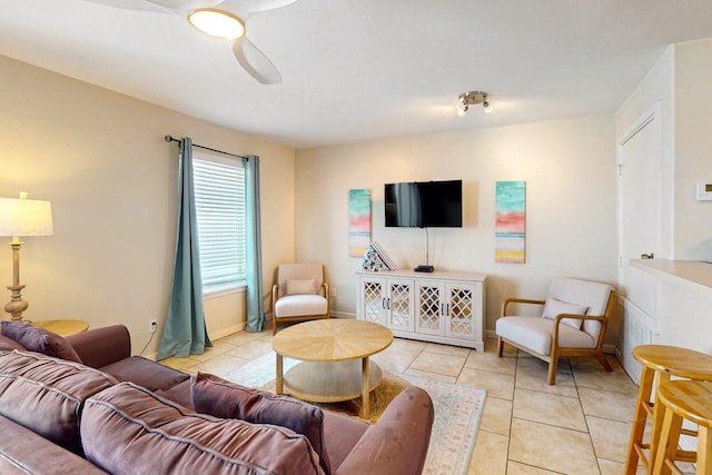 living room featuring light tile patterned flooring and ceiling fan