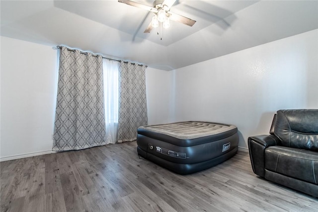 15957 San Felipe Dr, Corpus Christi, TX 78418 - bedroom featuring wood finished floors, a ceiling fan, and baseboards