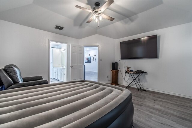 15957 San Felipe Dr, Corpus Christi, TX 78418 - bedroom with wood finished floors, ensuite bathroom, lofted ceiling, baseboards, and ceiling fan
