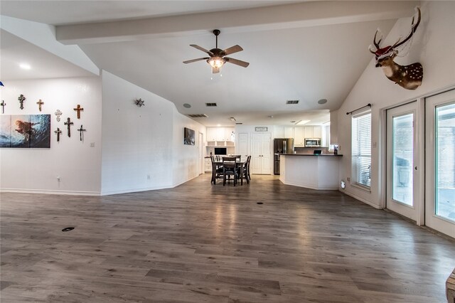 unfurnished living room featuring high vaulted ceiling, beamed ceiling, ceiling fan, and dark hardwood / wood-style floors