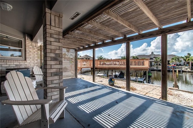 15957 San Felipe Dr, Corpus Christi, TX 78418 - dock featuring a water view, a pergola, and a patio area