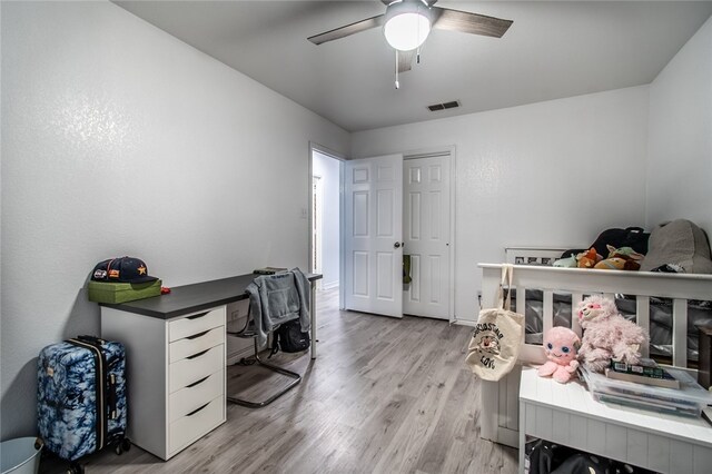 office space with ceiling fan and light hardwood / wood-style floors