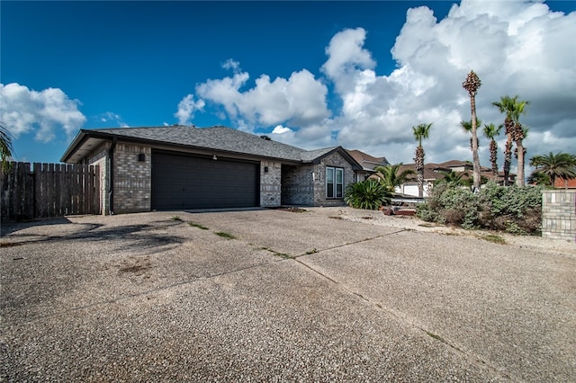 single story home featuring a garage