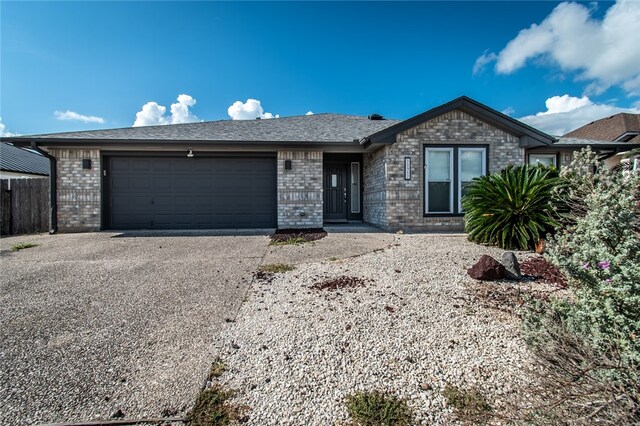 single story home with a garage