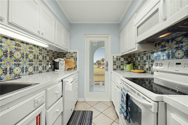 kitchen featuring white appliances, white cabinetry, decorative backsplash, light tile patterned floors, and crown molding