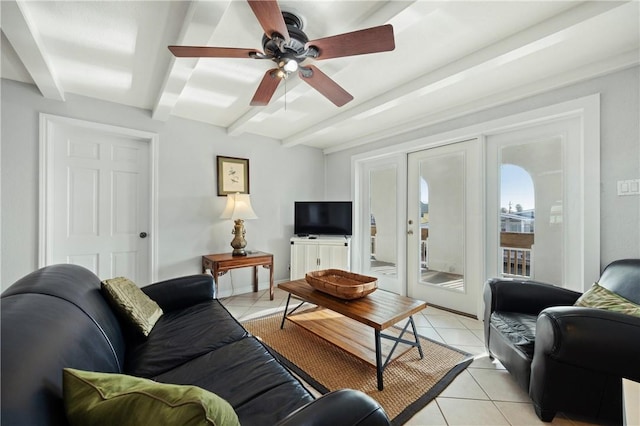 tiled living room with ceiling fan and beam ceiling