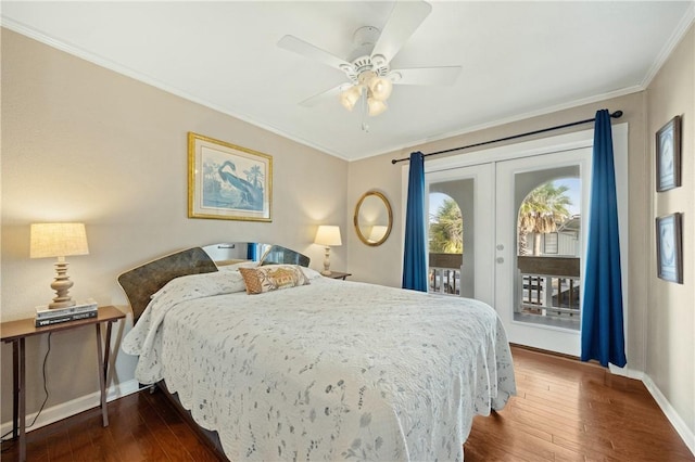 bedroom featuring french doors, access to exterior, dark hardwood / wood-style floors, ceiling fan, and crown molding