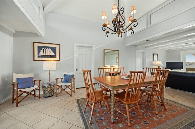 tiled dining area featuring beamed ceiling and a high ceiling