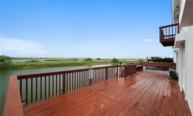 wooden deck with a water view