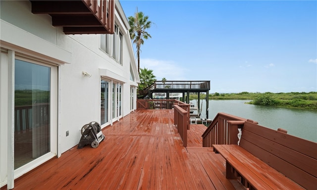 deck featuring a water view