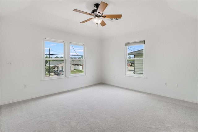 3401 Laguna Shores Rd, Corpus Christi, TX 78418 - spare room with plenty of natural light, carpet, and a ceiling fan