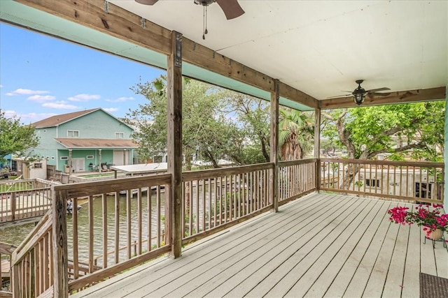 deck featuring a residential view and a ceiling fan