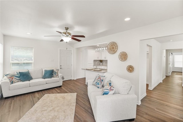 living area featuring dark wood-style floors and plenty of natural light