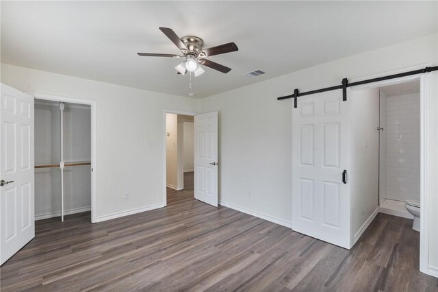 bathroom featuring sink, wood-type flooring, toilet, and tiled shower