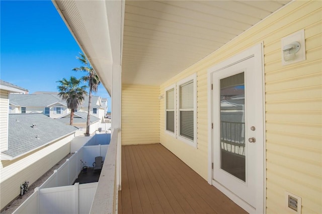 wooden deck featuring a residential view and fence