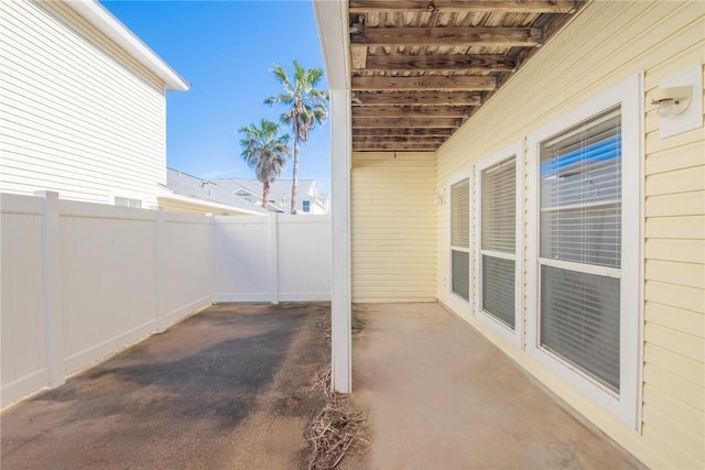 view of patio / terrace featuring fence