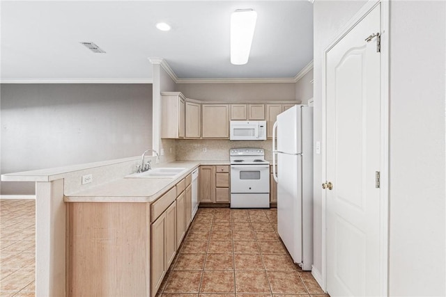 kitchen with crown molding, white appliances, light countertops, and a sink