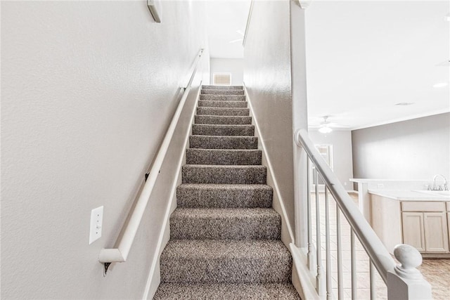 stairway with visible vents and ceiling fan