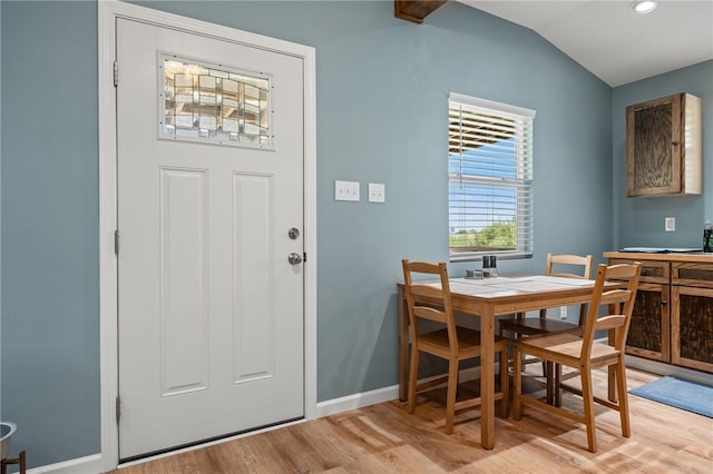 dining area featuring baseboards, light wood finished floors, recessed lighting, and lofted ceiling