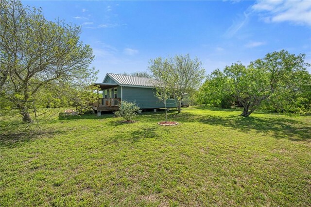 view of yard with a deck