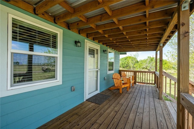 wooden terrace featuring covered porch
