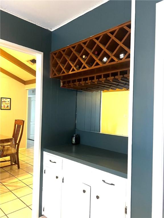 kitchen with tile patterned floors and lofted ceiling