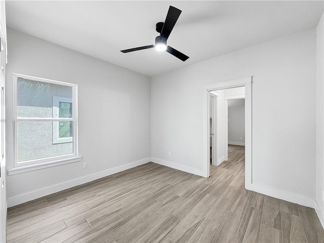 6222 Sadie St, Corpus Christi, TX 78415 - spare room featuring light wood-style flooring, baseboards, and ceiling fan