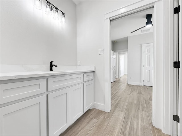 6222 Sadie St, Corpus Christi, TX 78415 - bathroom featuring visible vents, vanity, baseboards, and wood finished floors