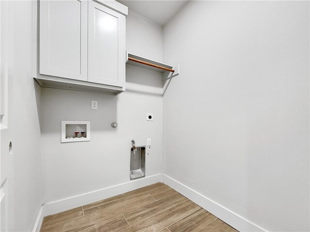 6222 Sadie St, Corpus Christi, TX 78415 - washroom featuring light wood finished floors, baseboards, gas dryer hookup, hookup for a washing machine, and electric dryer hookup