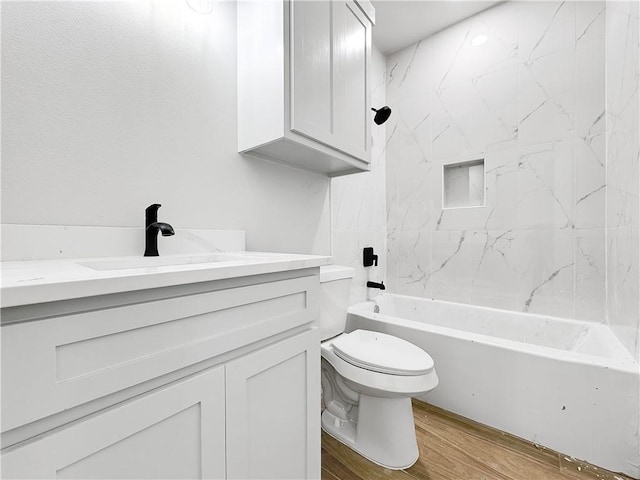 6222 Sadie St, Corpus Christi, TX 78415 - full bathroom featuring shower / washtub combination, toilet, vanity, and wood finished floors