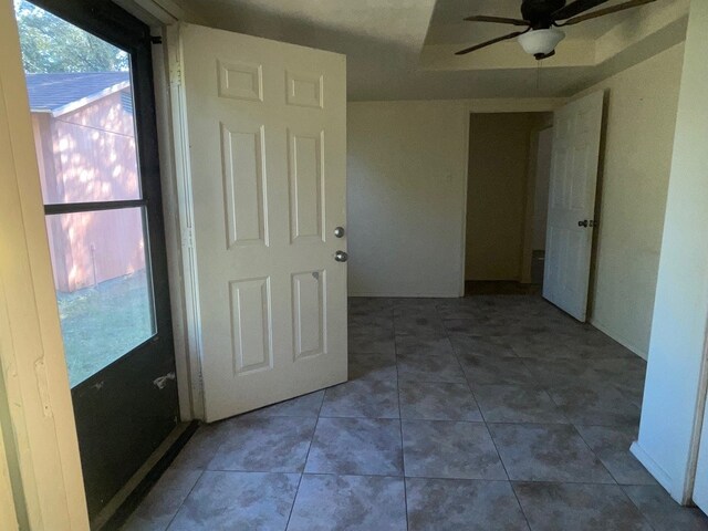 hallway with tile patterned floors