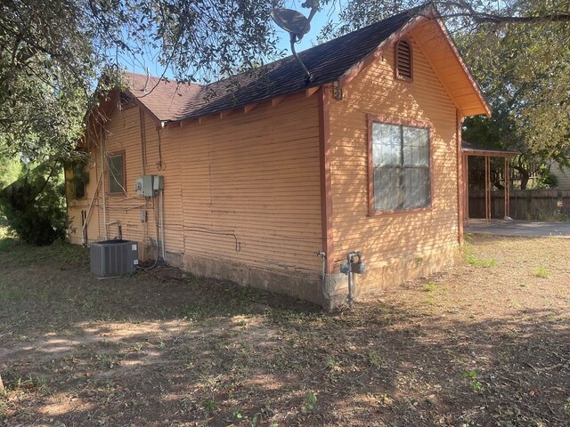 view of home's exterior with cooling unit