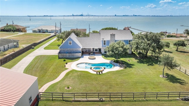 birds eye view of property with a water view