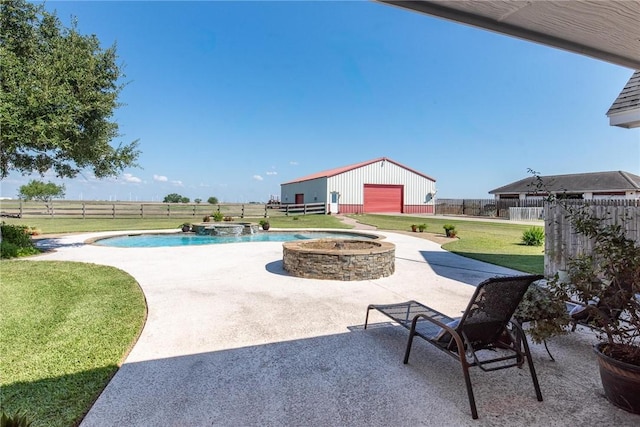 view of patio / terrace with a swimming pool with hot tub, an outdoor structure, and a garage