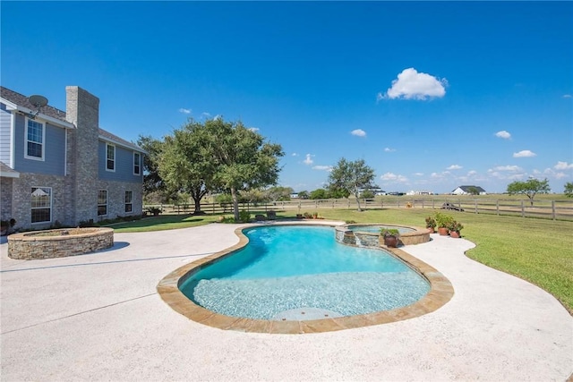 view of swimming pool with a lawn, a patio area, and an in ground hot tub