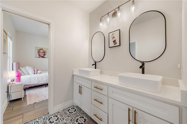 734 Buffalo Creek Dr, Corpus Christi, TX 78415 - ensuite bathroom with baseboards and double vanity