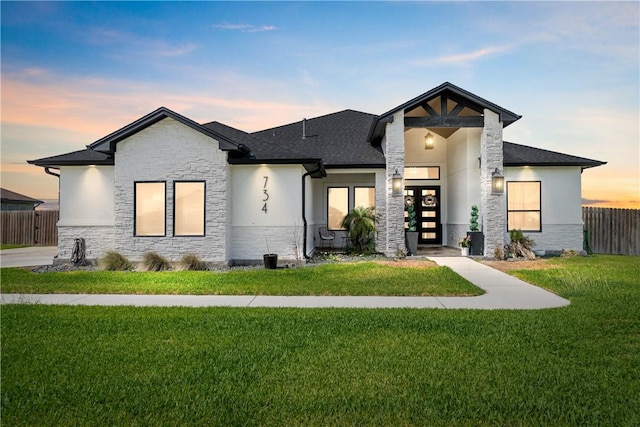 734 Buffalo Creek Dr, Corpus Christi, TX 78415 - contemporary home with stone siding, stucco siding, and roof with shingles