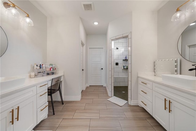 734 Buffalo Creek Dr, Corpus Christi, TX 78415 - full bath featuring two vanities, a tile shower, and recessed lighting