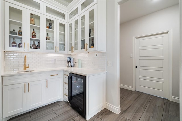 734 Buffalo Creek Dr, Corpus Christi, TX 78415 - indoor bar featuring wine cooler, backsplash, and wood tiled floors