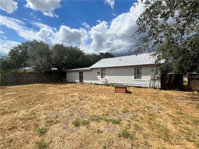 305 Laredo St, Freer, TX 78357 - rear view of house with metal roof