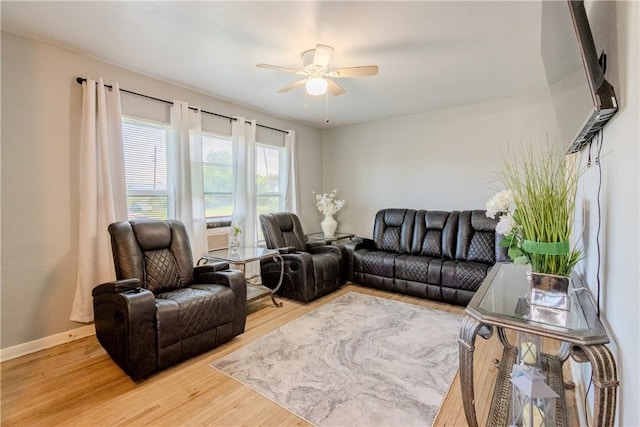1001 Azalea Dr, Corpus Christi, TX 78408 - living room featuring light wood-style flooring, a ceiling fan, and baseboards