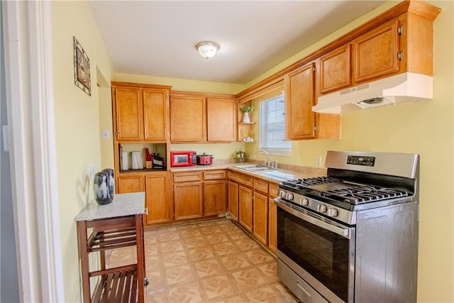 1001 Azalea Dr, Corpus Christi, TX 78408 - kitchen with stainless steel gas range oven, under cabinet range hood, a sink, light countertops, and open shelves