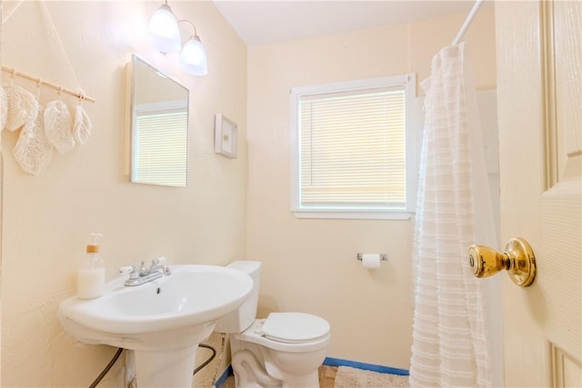 1001 Azalea Dr, Corpus Christi, TX 78408 - bathroom featuring a shower with curtain and toilet
