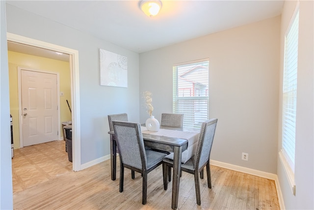 dining area with light hardwood / wood-style flooring