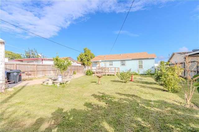 view of yard featuring a wooden deck