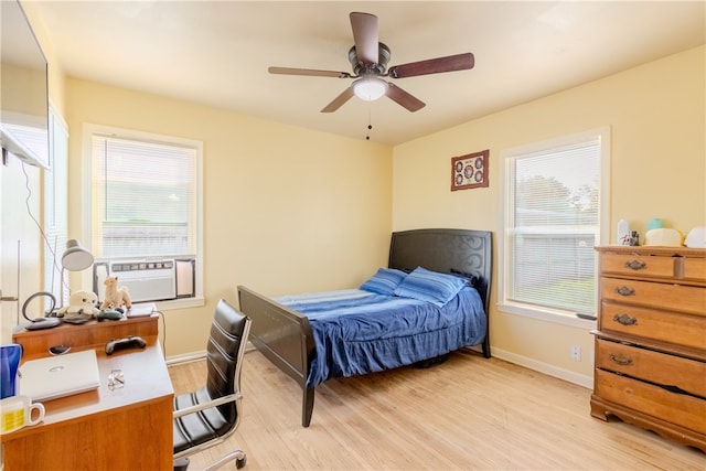 bedroom with light hardwood / wood-style flooring and ceiling fan