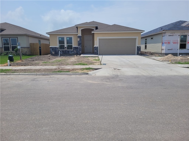 view of front of property with a garage